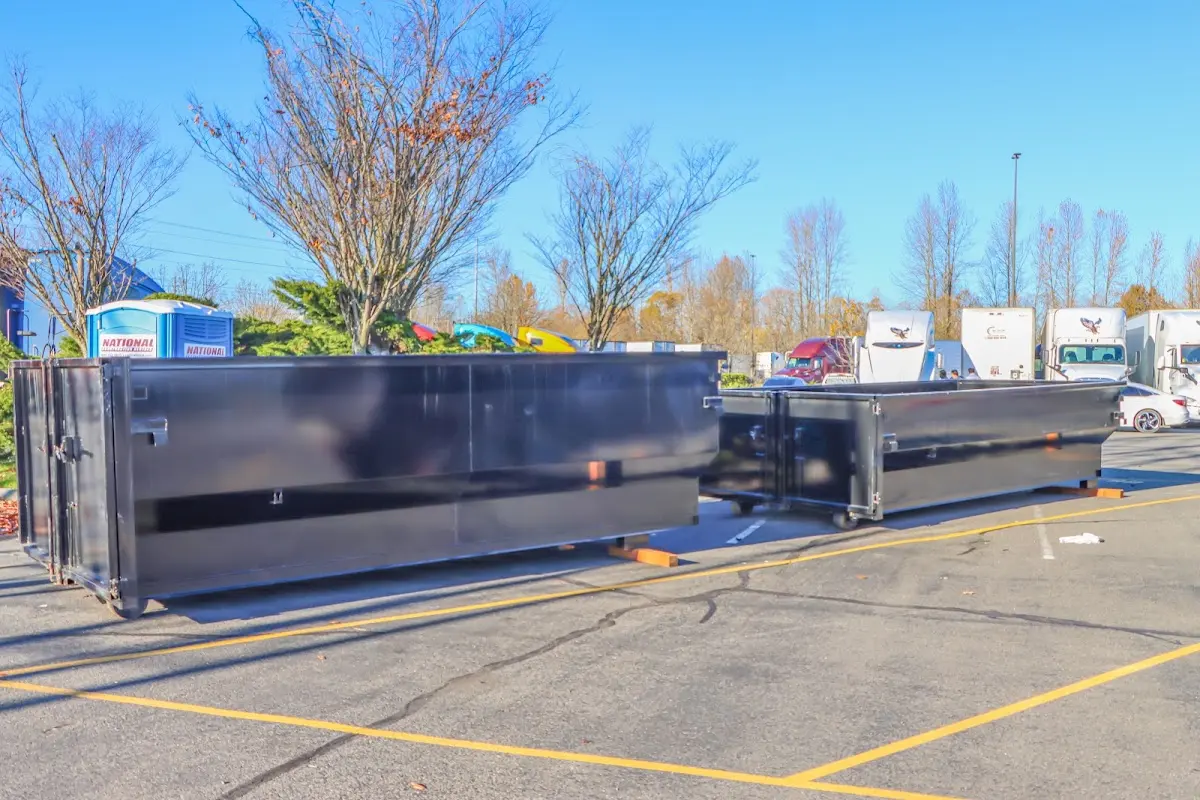 Professional dumpster rental service with roll-off container on residential driveway in Indian Trail